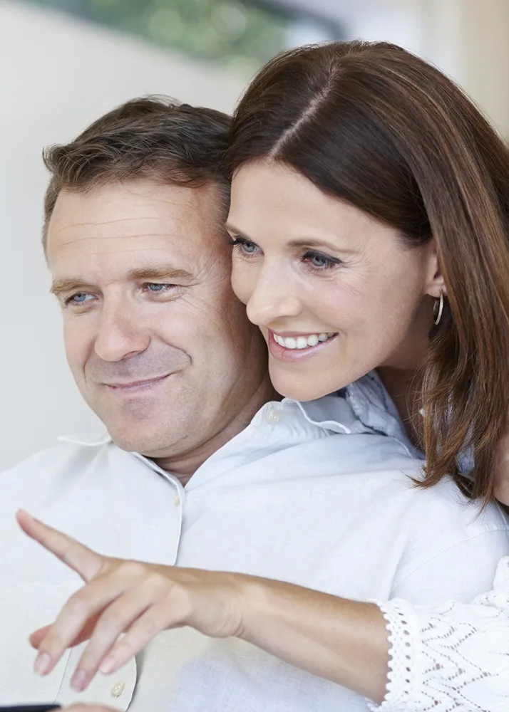 A man and a woman reading about how life insurance works.