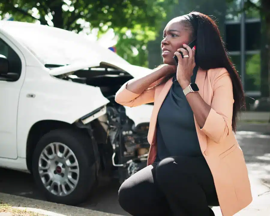 Woman on phone after car accident